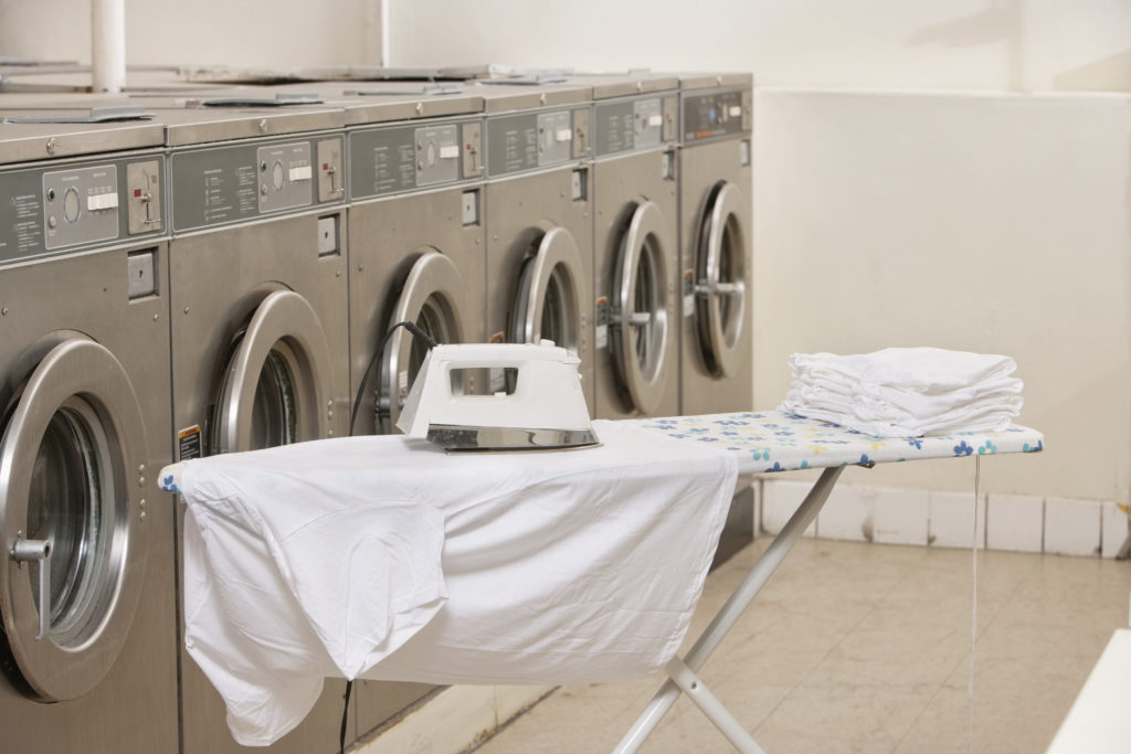 Ironing board with washing machines